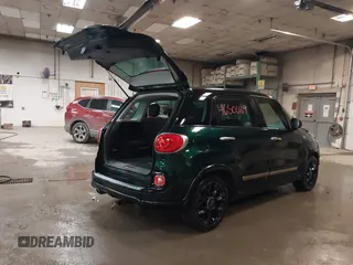 2015 FIAT 500L Urbana Trekking with VIN ZFBCFADHXFZ033922, listed as a IAAI auction lot 41650689 with 139,085 mi miles and . Bid and sale history available at DreamBid. Image 4.