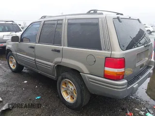 1998 Jeep Grand Cherokee Limited with VIN 1J4GZ78YXWC236969, listed as a IAAI auction lot 41095686 with 182,001 mi miles. Bid and sale history available at carsss.com. Image 3.