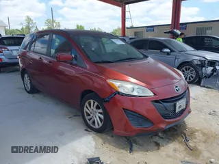 2012 Mazda 5 Sport z VIN JM1CW2BL4C0119625, wystawiony jako IAAI lot #42306364 z przebiegiem 138 906 mil mil oraz . Historia ofert i sprzedaży dostępna na DreamBid. Obrazek 1.