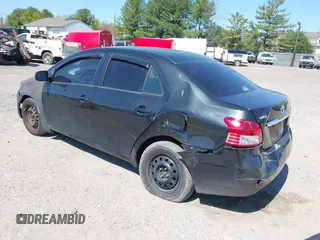 2009 Toyota Yaris with VIN JTDBT903294057773, listed as a IAAI auction lot 42071027 with 164,128 mi miles. Bid and sale history available at carsss.com. Image 3.
