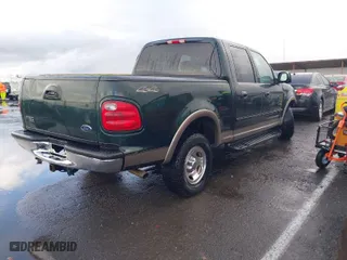 2001 Ford F-150 SuperCrew XLT with VIN 1FTRW08W41KA63428, listed as a IAAI auction lot 41565419 with 181,557 mi miles. Bid and sale history available at carsss.com. Image 4.