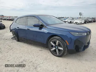 2023 BMW iX M60 with VIN WB533CF01PCM29925, listed as a Copart auction lot 54160244 with 8,226 mi miles and Salvage Title. Bid and sale history available at carsss.com. Image 4.
