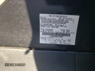 2015 Ford Taurus SEL with VIN 1FAHP2E90FG148821, listed as a Copart auction lot 77557384 with 141,514 mi miles and Salvage Title. Bid and sale history available at DreamBid. Image 13.