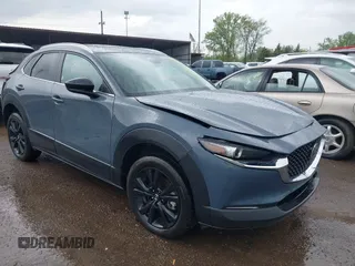 2025 Mazda CX-30 S Carbon Edition with VIN 3MVDMBCM6SM813356, listed as a IAAI auction lot 42165714 with 2,338 mi miles and . Bid and sale history available at DreamBid. Image 1.