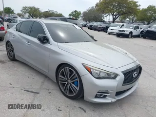 2014 Infiniti Q50 Premium z VIN JN1BV7AP4EM692135, wystawiony jako IAAI lot #38874654 z przebiegiem 104 348 mil mil oraz . Historia ofert i sprzedaży dostępna na DreamBid. Obrazek 1.