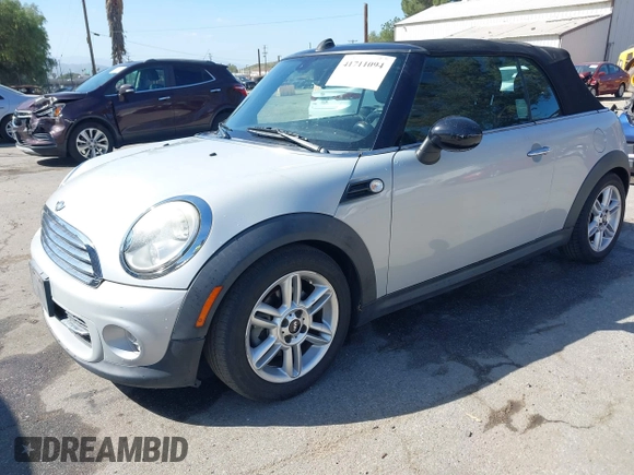 2011 MINI Convertible with VIN WMWZN3C57BT133094, listed as a IAAI auction lot 41711094 with 96,056 mi miles and . Bid and sale history available at DreamBid. Image 2.