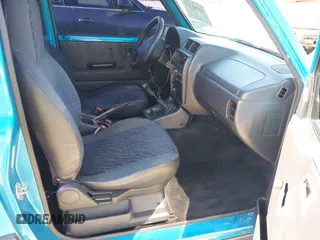 1997 Chevrolet Tracker z VIN 2CNBE1865V6904672, wystawiony jako IAAI lot #41296166 z przebiegiem 266 743 mil mil oraz . Historia ofert i sprzedaży dostępna na DreamBid. Obrazek 5.