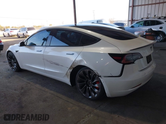2021 Tesla Model 3 Performance with VIN 5YJ3E1EC4MF097993, listed as a IAAI auction lot 41366615 with 30,735 mi miles and . Bid and sale history available at DreamBid. Image 3.