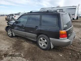 1999 Subaru Forester S with VIN JF1SF6550XH735142, listed as a Copart auction lot 85818264 with 0 mi miles and Salvage Title. Bid and sale history available at carsss.com. Image 2.