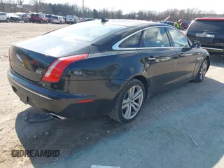 2013 Jaguar XJ Portfolio with VIN SAJWJ2GDXD8V55879, listed as a IAAI auction lot 41568366 with 121,119 mi miles and . Bid and sale history available at DreamBid. Image 4.