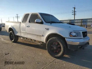 2000 Ford F-150 XL with VIN 1FTRX18L3YKA09007, listed as a Copart auction lot 42828005 with 218,563 mi miles and Salvage Title. Bid and sale history available at carsss.com. Image 4.