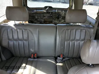 1999 Jeep Grand Cherokee Limited with VIN 1J4GW68S2XC677334, listed as a Copart auction lot 74152054 with 242,220 mi miles and Salvage Title. Bid and sale history available at carsss.com. Image 10.