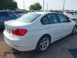 2015 BMW 3 Series 320i with VIN WBA3B1G5XFNT05903, listed as a IAAI auction lot 42063574 with Not Provided miles. Bid and sale history available at carsss.com. Image 4.