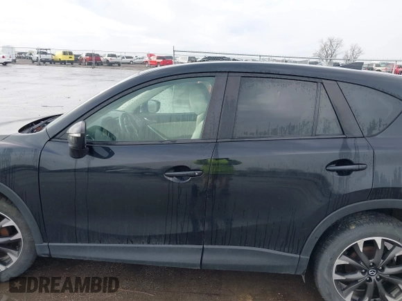 2016 Mazda CX-5 Grand Touring with VIN JM3KE4DY3G0769448, listed as a IAAI auction lot 41947725 with 154,051 mi miles and . Bid and sale history available at carsss.com. Image 14.