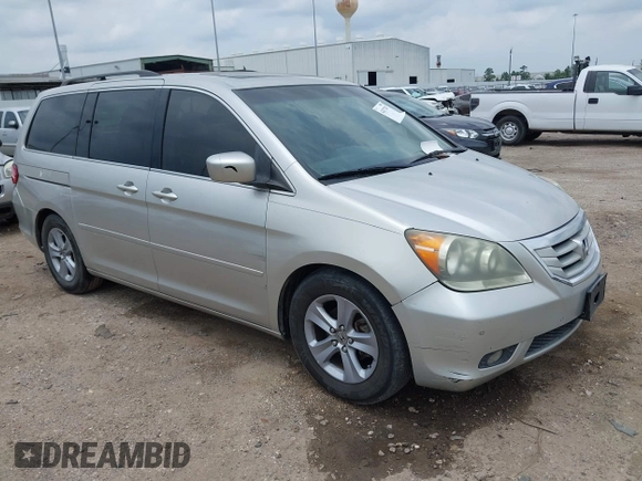 2009 Honda Odyssey Touring z VIN 5FNRL38979B052923, wystawiony jako IAAI lot #42427207 z przebiegiem 201 483 mil mil oraz . Historia ofert i sprzedaży dostępna na DreamBid. Obrazek 1.