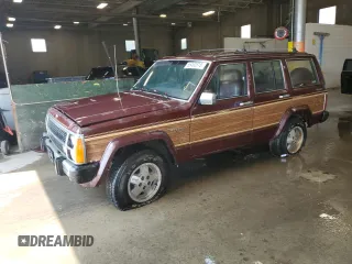 1988 Jeep Grand Wagoneer with VIN 1JCMT7542JT150879, listed as a Copart auction lot 66490815 with 147,737 mi miles and Clean title. Bid and sale history available at DreamBid. Image 1.