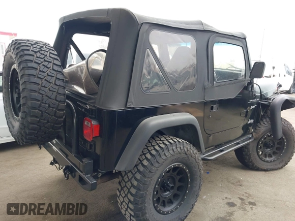 2002 Jeep Wrangler Sport with VIN 1J4FA49S02P705470, listed as a IAAI auction lot 42477770 with 59,395 mi miles and . Bid and sale history available at DreamBid. Image 4.