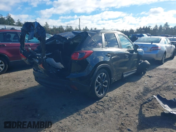 2016 Mazda CX-5 Grand Touring with VIN JM3KE4DY4G0909782, listed as a IAAI auction lot 41006111 with 30,135 mi miles. Bid and sale history available at carsss.com. Image 4.