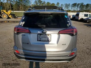 2016 Toyota RAV4 XLE with VIN 2T3WFREV4GW243771, listed as a Copart auction lot 48159685 with 104,490 mi miles and Clean Title. Bid and sale history available at carsss.com. Image 6.