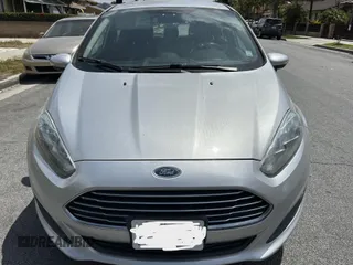 2015 Ford Fiesta SE z VIN 3FADP4EJ8FM167515, wystawiony jako IAAI lot #42153873 z przebiegiem 100 559 mil mil oraz . Historia ofert i sprzedaży dostępna na DreamBid. Obrazek 6.