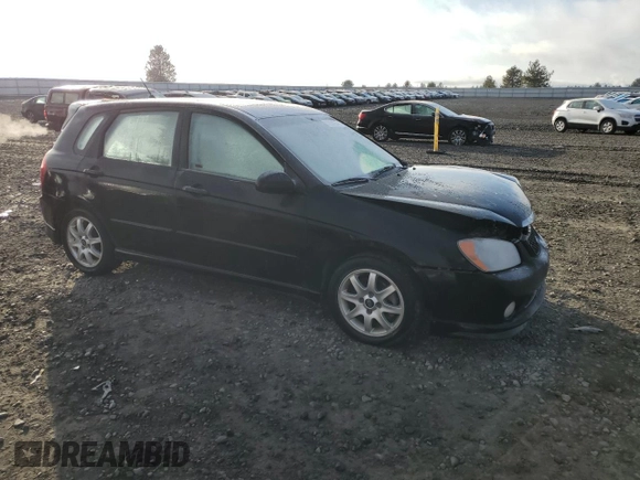 2005 Kia Spectra with VIN KNAFE161655093051, listed as a Copart auction lot 77821904 with 104,874 mi miles and Salvage Title. Bid and sale history available at carsss.com. Image 4.