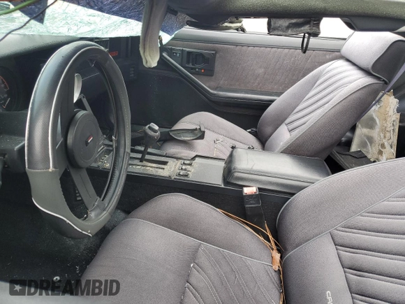 1987 Chevrolet Camaro z VIN 1G1FP21H2HN131699, wystawiony jako Copart lot #87860445 z przebiegiem 86 117 mil mil oraz Szkoda całkowita • Salvage title. Historia ofert i sprzedaży dostępna na DreamBid. Obrazek 7.