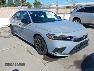 2022 Honda Civic Sport with VIN 2HGFE2F57NH600299, listed as a IAAI auction lot 41709059 with 9,060 mi miles and . Bid and sale history available at carsss.com. Image 1.