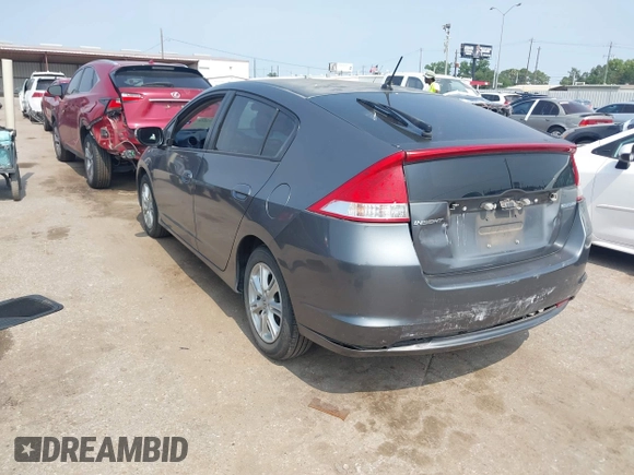 2010 Honda Insight EX with VIN JHMZE2H71AS043465, listed as a IAAI auction lot 42312556 with 151,009 mi miles and . Bid and sale history available at DreamBid. Image 3.