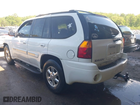 2003 GMC Envoy SLT with VIN 1GKDT13S432190085, listed as a IAAI auction lot 42106915 with 289,933 mi miles. Bid and sale history available at carsss.com. Image 3.