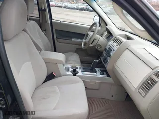 2009 Mercury Mariner Hybrid with VIN 4M2CU29359KJ09642, listed as a IAAI auction lot 41734762 with 233,989 mi miles. Bid and sale history available at carsss.com. Image 5.