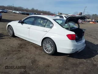 2014 BMW 3 Series 335i xDrive with VIN WBA3B9C52EJ466045, listed as a IAAI auction lot 41281384 with 136,329 mi miles. Bid and sale history available at carsss.com. Image 3.
