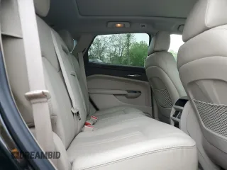 2015 Cadillac SRX Luxury Collection z VIN 3GYFNEE33FS574163, wystawiony jako Copart lot #56667985 z przebiegiem 103 697 mil mil oraz Szkody całkowita. Historia ofert i sprzedaży dostępna na DreamBid. Obrazek 11.