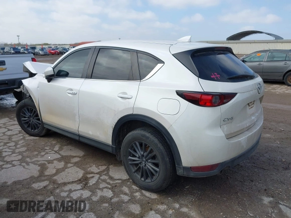 2020 Mazda CX-5 Touring with VIN JM3KFACM9L0771919, listed as a IAAI auction lot 41527773 with 93,417 mi miles and . Bid and sale history available at DreamBid. Image 3.