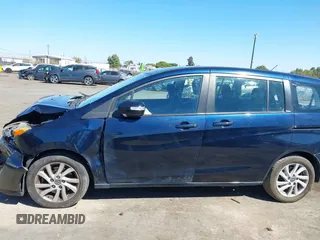 2014 Mazda 5 Sport with VIN JM1CW2BLXE0175975, listed as a IAAI auction lot 40278614 with 102,430 mi miles and . Bid and sale history available at DreamBid. Image 14.