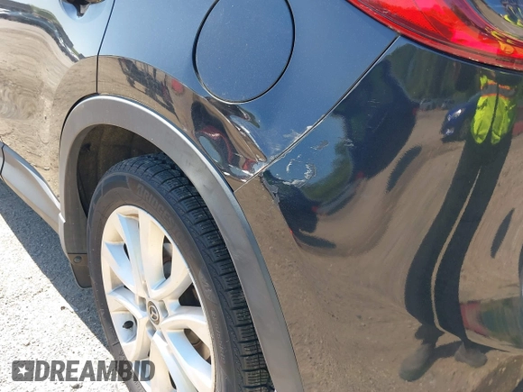 2013 Mazda CX-5 Grand Touring with VIN JM3KE4DE6D0127601, listed as a IAAI auction lot 42143558 with 95,719 mi miles and . Bid and sale history available at DreamBid. Image 17.