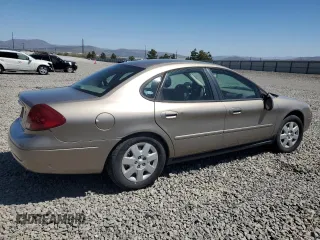 2003 Ford Taurus LX Standard z VIN 1FAFP52U63G277370, wystawiony jako Copart lot #56184345 z przebiegiem 115 778 mil mil oraz Szkoda całkowita • Salvage title. Historia ofert i sprzedaży dostępna na DreamBid. Obrazek 3.