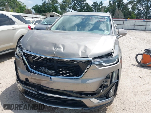 2022 Cadillac XT6 Premium Luxury z VIN 1GYKPCRS4NZ107852, wystawiony jako IAAI lot #42075012 z przebiegiem 66 046 mil mil oraz . Historia ofert i sprzedaży dostępna na DreamBid. Obrazek 6.
