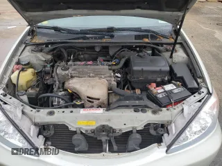 2004 Toyota Camry LE z VIN JTDBE32K940297754, wystawiony jako Copart lot #55809155 z przebiegiem 232 092 mil mil oraz Szkoda całkowita • Salvage title. Historia ofert i sprzedaży dostępna na DreamBid. Obrazek 11.