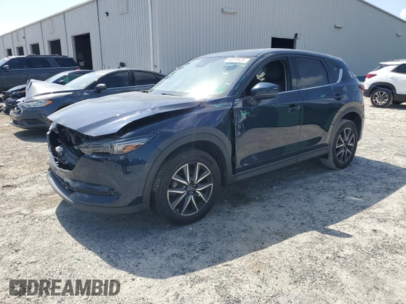2018 Mazda CX-5 Grand Touring with VIN JM3KFADM1J1387297, listed as a Copart auction lot 60589625 with 92,283 mi miles and Non repairable. Bid and sale history available at DreamBid. Image 1.