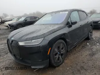 2022 BMW iX xDrive50 with VIN WB523CF06NCJ58191, listed as a Copart auction lot 84034634 with 0 mi miles and Salvage Title. Bid and sale history available at carsss.com. Image 1.