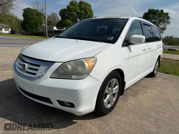 2010 Honda Odyssey Touring with VIN 5FNRL3H94AB047330, listed as a Copart auction lot 54064195 with 193,979 mi miles and Clean Title. Bid and sale history available at carsss.com. Image 2.