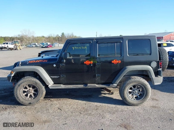 2010 Jeep Wrangler Unlimited Sport with VIN 1J4BA3H17AL219679, listed as a IAAI auction lot 42010714 with 194,172 mi miles. Bid and sale history available at carsss.com. Image 14.