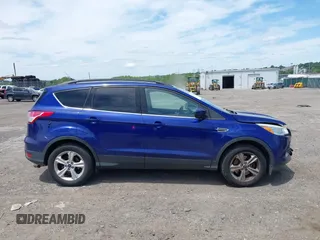 2016 Ford Escape SE z VIN 1FMCU9GX0GUA76647, wystawiony jako IAAI lot #42314233 z przebiegiem 86 010 mil mil oraz . Historia ofert i sprzedaży dostępna na DreamBid. Obrazek 14.