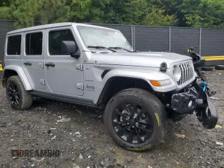 2024 Jeep Wrangler Sahara with VIN 1C4RJXP65RW210689, listed as a Copart auction lot 66482724 with 4,872 mi miles and Salvage Title. Bid and sale history available at DreamBid. Image 4.