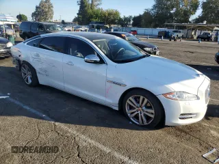 2014 Jaguar XJ with VIN SAJWA2GZ7E8V66626, listed as a Copart auction lot 78824254 with 132,720 mi miles and Salvage Title. Bid and sale history available at carsss.com. Image 4.