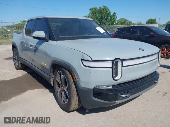 2022 Rivian R1T Adventure z VIN 7FCTGAAA2NN006053, wystawiony jako IAAI lot #41974199 z przebiegiem 286 mil mil oraz . Historia ofert i sprzedaży dostępna na DreamBid. Obrazek 1.