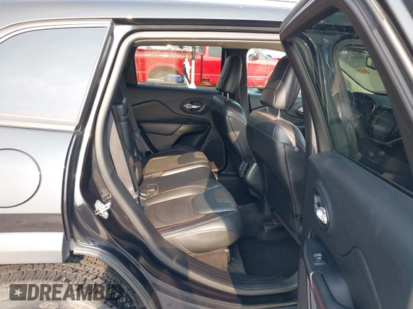 2015 Jeep Cherokee Trailhawk with VIN 1C4PJMBS6FW786622, listed as a IAAI auction lot 42403215 with 148,205 mi miles and . Bid and sale history available at DreamBid. Image 8.