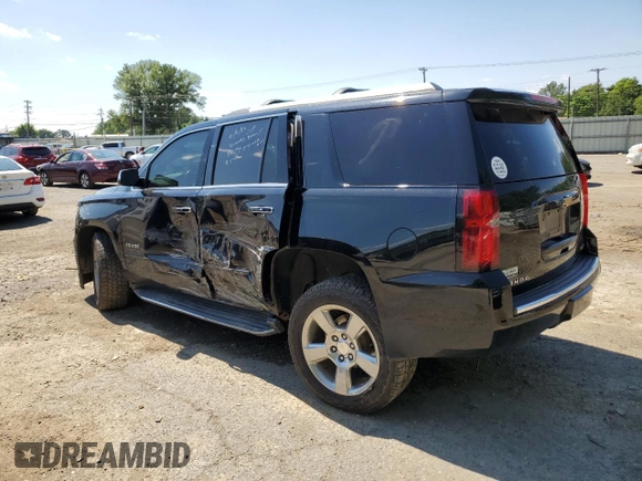 2018 Chevrolet Tahoe Premier with VIN 1GNSKCKC1JR133625, listed as a Copart auction lot 54900974 with 130,921 mi miles and Salvage title. Bid and sale history available at DreamBid. Image 2.