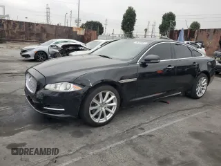 2013 Jaguar XJ with VIN SAJWA1C72D8V55787, listed as a Copart auction lot 76296884 with 94,872 mi miles and Salvage Title. Bid and sale history available at DreamBid. Image 1.