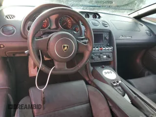 2012 Lamborghini Gallardo z VIN ZHWGU6BZ7CLA11933, wystawiony jako Copart lot #74679154 z przebiegiem Nie podano mil oraz Szkody całkowita. Historia ofert i sprzedaży dostępna na DreamBid. Obrazek 8.